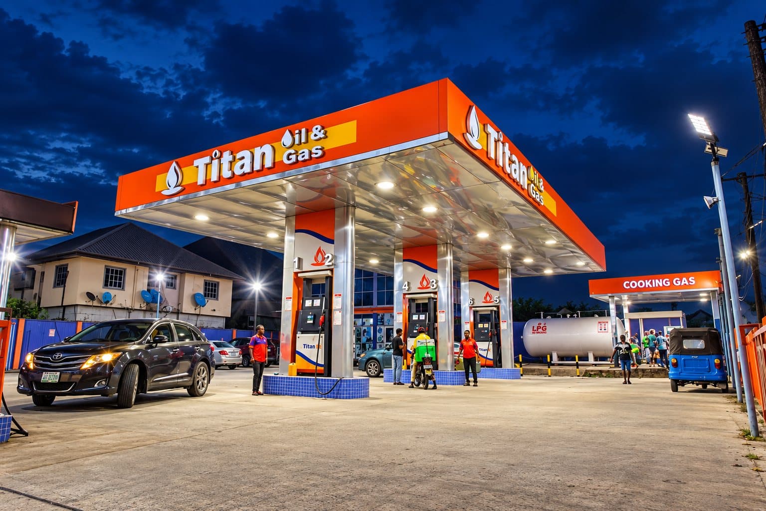 Cars refuelling at Titan Ada George at dusk