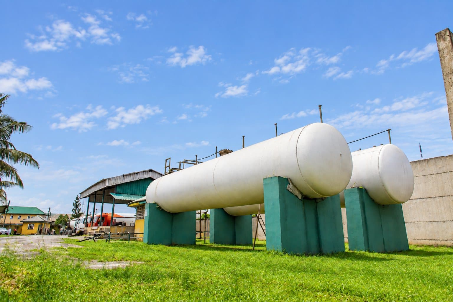 Two LPG storage bullets on green saddles